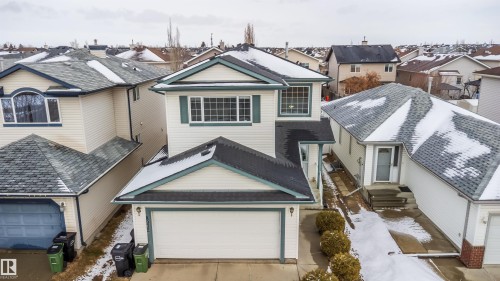 The property features a two-story design with a prominent front-facing garage - 8932 175 Avenue, Edmonton, AB - Outdoor