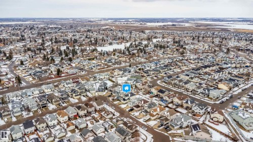 Aerial view of the residential area, featuring a dense arrangement of homes with various roof styles and colors - 8932 175 Avenue, Edmonton, AB - Outdoor With View