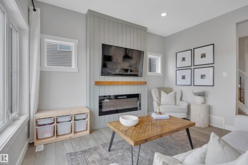 7490 Creighton Place, Edmonton, AB - Indoor Photo Showing Living Room With Fireplace