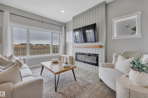 7490 Creighton Place, Edmonton, AB - Indoor Photo Showing Living Room With Fireplace