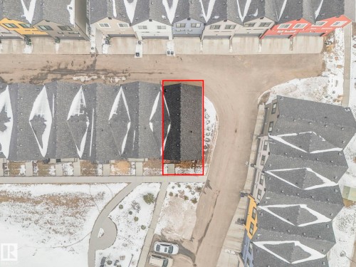 Aerial view of the property, highlighted in red, featuring a dark shingle roof - 95 1010 Rabbit Hill Road, Edmonton, AB - Other
