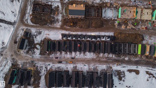 Aerial view of the community, showcasing newly constructed properties and properties under construction - 444 Crystal Creek Link, Leduc, AB - Outdoor