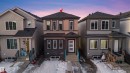 The property features a dark gray shingled roof and light brown siding with dark brown trim - 444 Crystal Creek Link, Leduc, AB  - Outdoor 