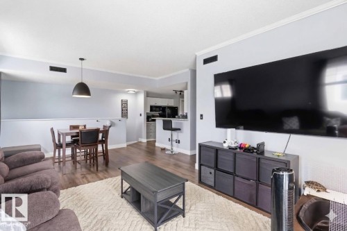 11 1179 Summerside Drive, Edmonton, AB - Indoor Photo Showing Living Room