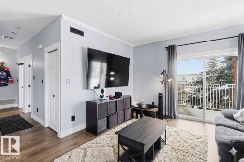 11 1179 Summerside Drive, Edmonton, AB - Indoor Photo Showing Living Room