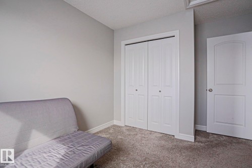 This room features light grey walls and grey carpet - 1424 Mcconachie Boulevard, Edmonton, AB - Indoor Photo Showing Bedroom