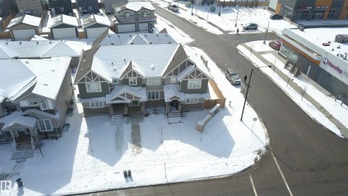 The property features a multi-level design with prominent gables and a covered front entry - 1424 Mcconachie Boulevard, Edmonton, AB - Outdoor With Facade