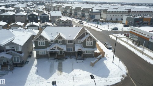 This property features a contemporary architectural style with multiple gables and a stone facade accent - 1424 Mcconachie Boulevard, Edmonton, AB - Outdoor With Facade