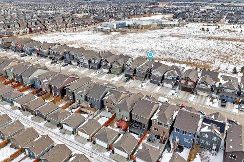 Aerial view of a residential area featuring numerous properties with various exterior colors and roof styles - 2935 Chokecherry Common, Edmonton, AB - Outdoor
