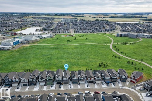 Aerial view highlighting the property's proximity to an expansive green space with walking paths - 2935 Chokecherry Common, Edmonton, AB - Outdoor With View