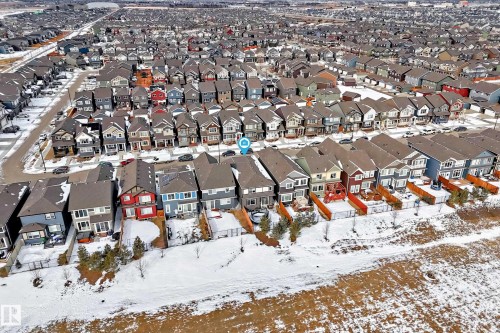 Aerial view of the property and surrounding neighborhood, featuring residential homes with private backyards - 2935 Chokecherry Common, Edmonton, AB - Outdoor With View