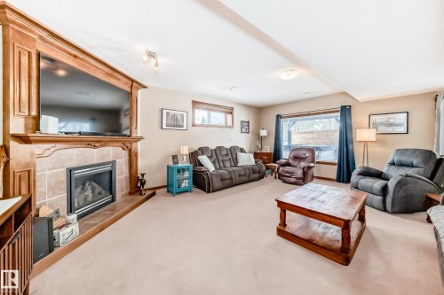 9 Linksview Cv, Spruce Grove, AB - Indoor Photo Showing Living Room With Fireplace