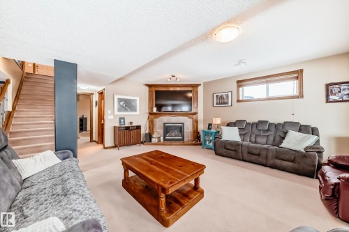 9 Linksview Cv, Spruce Grove, AB - Indoor Photo Showing Living Room With Fireplace