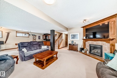 9 Linksview Cv, Spruce Grove, AB - Indoor Photo Showing Living Room With Fireplace