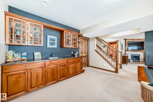 9 Linksview Cv, Spruce Grove, AB - Indoor Photo Showing Other Room With Fireplace