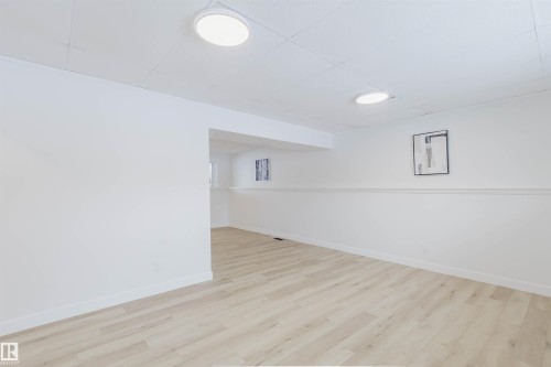 Spacious room with light-colored flooring, white walls, and recessed lighting fixtures - 11528 42 Avenue, Edmonton, AB - Indoor Photo Showing Other Room
