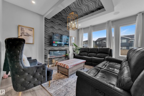 5213 22A Avenue, Edmonton, AB - Indoor Photo Showing Living Room With Fireplace