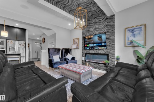 5213 22A Avenue, Edmonton, AB - Indoor Photo Showing Living Room With Fireplace