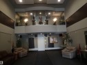 Spacious lobby area featuring high ceilings, recessed lighting, and a mezzanine level with decorative accents - 206 10208 120 Street, Edmonton, AB  - Indoor Photo Showing Other Room 