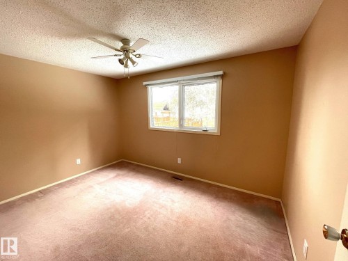 This room features a window providing natural light, a ceiling fan, and carpeted flooring - 44 Arlington Drive, St. Albert, AB - Indoor Photo Showing Other Room
