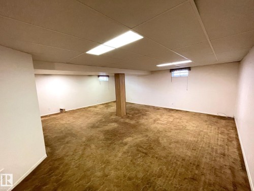Spacious room with white walls, brown carpeting, and recessed lighting - 44 Arlington Drive, St. Albert, AB - Indoor Photo Showing Basement