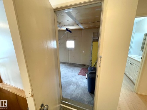 Interior view providing access to the garage and a separate room with a vanity - 44 Arlington Drive, St. Albert, AB - Indoor