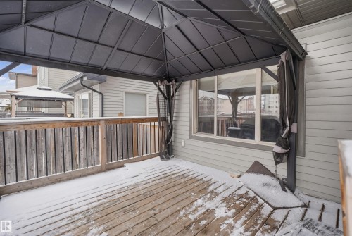 The property features a wooden deck with a covered gazebo, offering an outdoor living space - 469 Ainslie Crescent Sw, Edmonton, AB - Outdoor With Deck Patio Veranda With Exterior