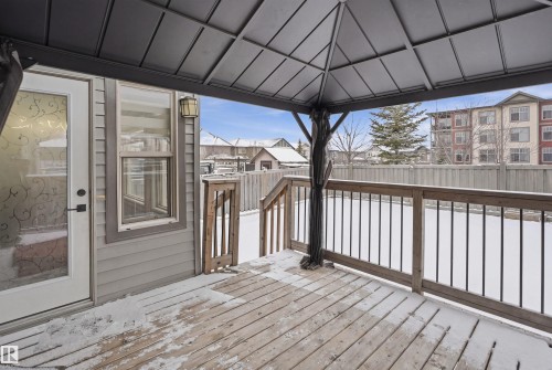 This property features a covered wooden deck, providing an outdoor living space - 469 Ainslie Crescent Sw, Edmonton, AB - Outdoor With Deck Patio Veranda With Exterior