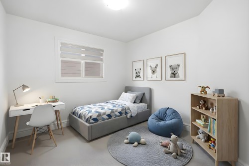 This room features light-colored walls and flooring, a window with horizontal blinds, and a ceiling light fixture - 469 Ainslie Crescent Sw, Edmonton, AB - Indoor Photo Showing Bedroom