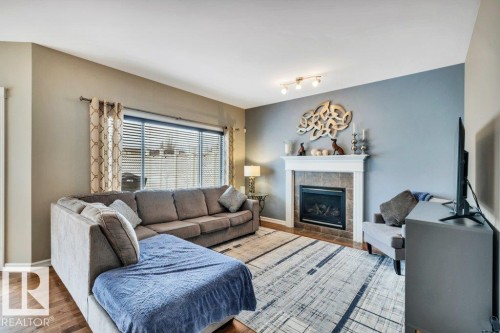 1 Rosemount, Beaumont, AB - Indoor Photo Showing Living Room With Fireplace