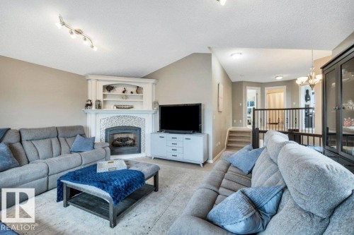 1 Rosemount, Beaumont, AB - Indoor Photo Showing Living Room With Fireplace
