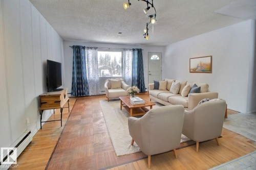 Virtually Staged - 5109 49 Avenue, Andrew, AB - Indoor Photo Showing Living Room