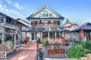 The property features a multi-level deck, a second-story balcony with railings, and a prominent gable roof - 11126 52 Street, Edmonton, AB  - Outdoor With Deck Patio Veranda With Facade 