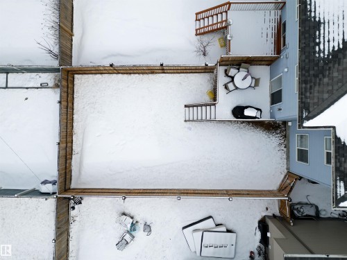 The property features a fenced yard with a deck and an additional balcony - 2132 52 St, Edmonton, AB - Outdoor