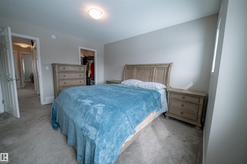 Bedroom featuring neutral-toned walls, carpeted flooring, and a ceiling light fixture - 2132 52 St, Edmonton, AB - Indoor Photo Showing Bedroom