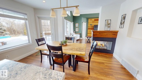458 Riverpark Drive, Fort Saskatchewan, AB - Indoor Photo Showing Dining Room With Fireplace