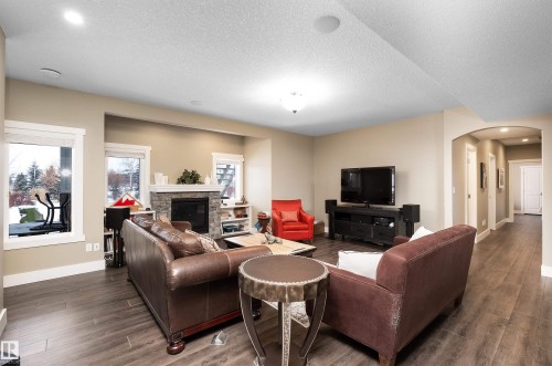 1079 Genesis Lake Boulevard, Stony Plain, AB - Indoor Photo Showing Living Room With Fireplace