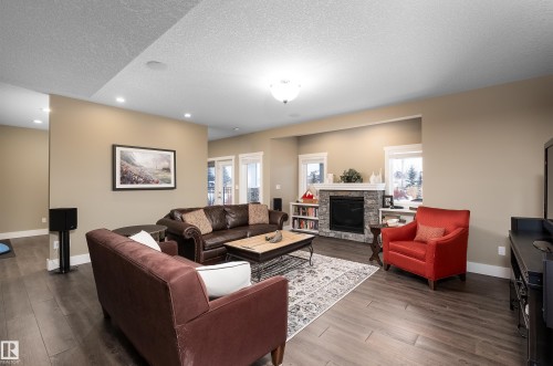 1079 Genesis Lake Boulevard, Stony Plain, AB - Indoor Photo Showing Living Room With Fireplace