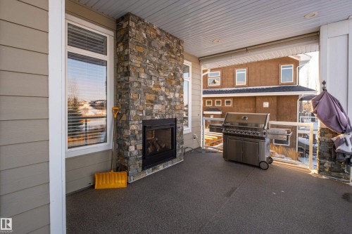 1079 Genesis Lake Boulevard, Stony Plain, AB - Outdoor With Fireplace With Exterior