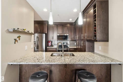 212 11080 Ellerslie Road, Edmonton, AB - Indoor Photo Showing Kitchen With Stainless Steel Kitchen With Double Sink With Upgraded Kitchen