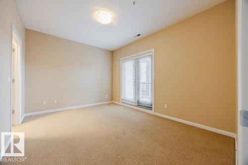 The primary bedroom is large enough to accommodate your king size bed and your bedroom furniture. - 217 160 Magrath Road, Edmonton, AB - Indoor Photo Showing Other Room