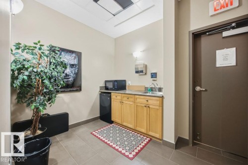 This kitchenette is located in the media space. - 217 160 Magrath Road, Edmonton, AB - Indoor Photo Showing Other Room