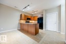 The entrance features ceramic tile flooring. - 217 160 Magrath Road, Edmonton, AB  - Indoor Photo Showing Kitchen 