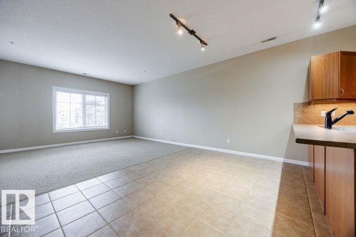 The dining room is very large and will accomodate large tables for seating of 10 or more. - 217 160 Magrath Road, Edmonton, AB - Indoor