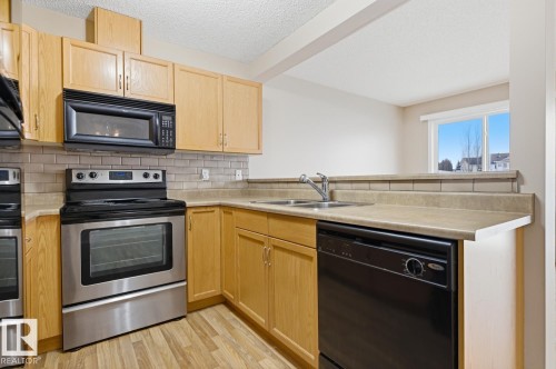 5913 164 Avenue, Edmonton, AB - Indoor Photo Showing Kitchen With Double Sink