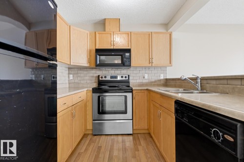 5913 164 Avenue, Edmonton, AB - Indoor Photo Showing Kitchen With Double Sink