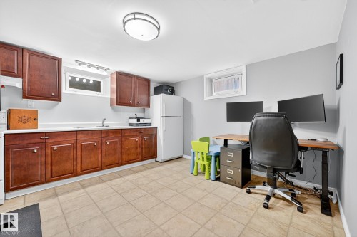 This versatile space features a light-colored tiled floor, white walls, and a recessed window - 15701 92A Avenue, Edmonton, AB - Indoor