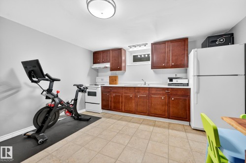 This functional space features tile flooring, white walls, and a recessed ceiling light - 15701 92A Avenue, Edmonton, AB - Indoor
