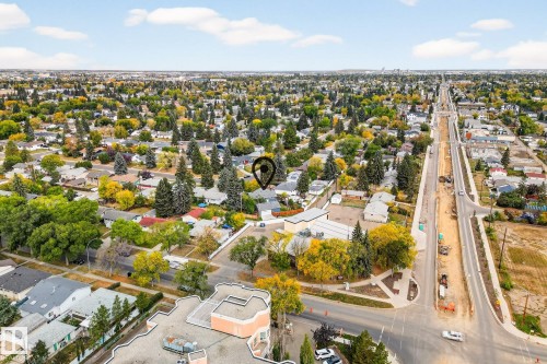 Aerial view showcasing a residential area with varied housing styles and mature trees - 15701 92A Avenue, Edmonton, AB - Outdoor With View