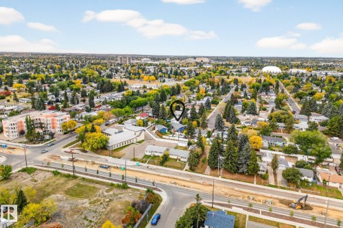 Aerial view showcasing the property's location within a neighborhood featuring extensive greenery and residential buildings - 15701 92A Avenue, Edmonton, AB - Outdoor With View